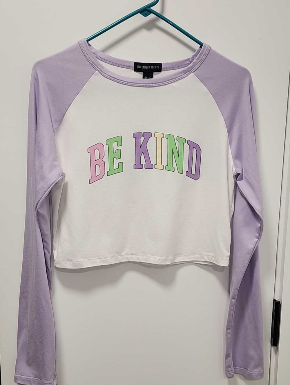 Streetwear Society Lavender & White 'BE KIND' Cropped Raglan Long Sleeve Tee